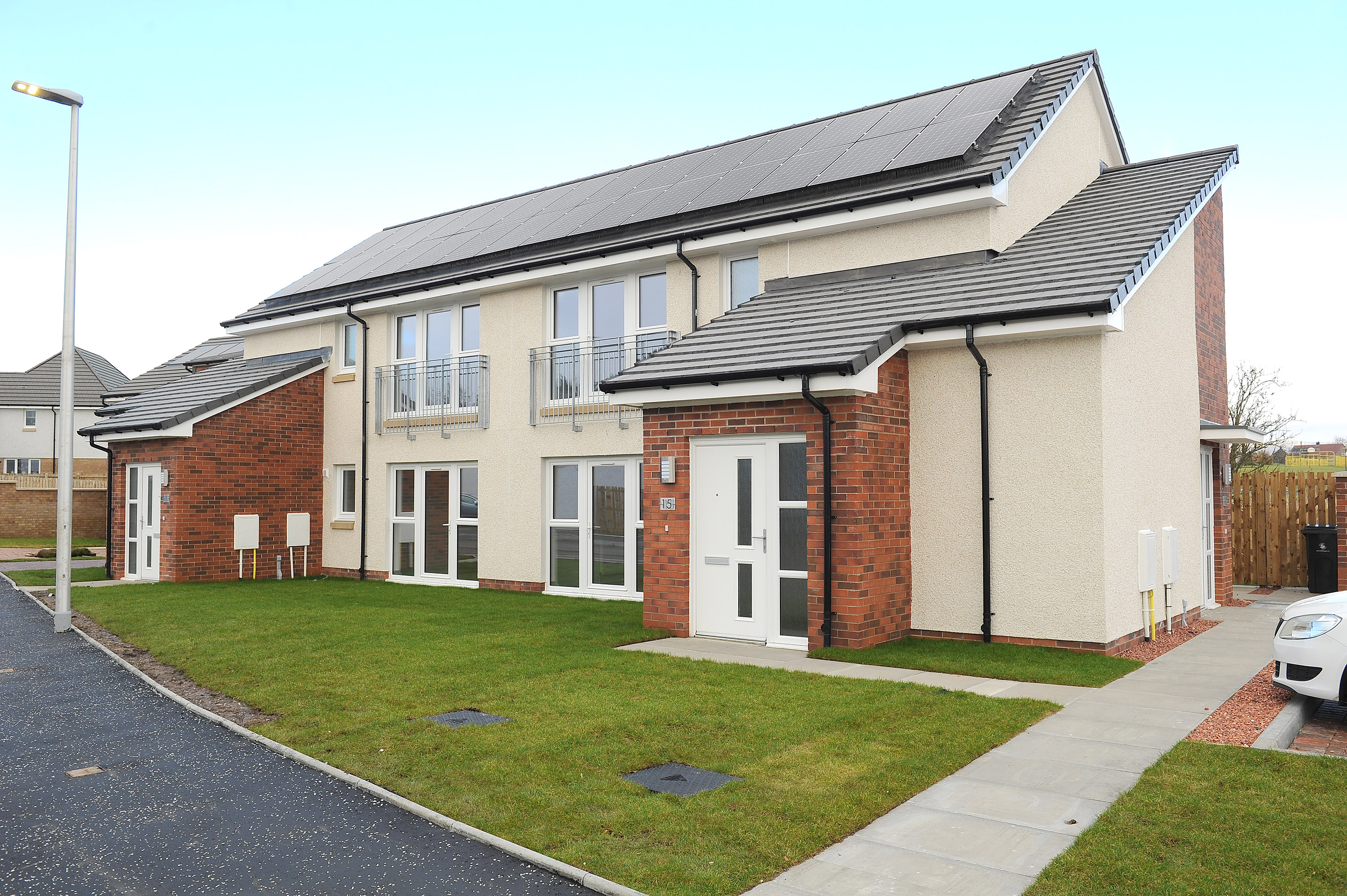 Families pick up the keys to new council housing in St Ninians